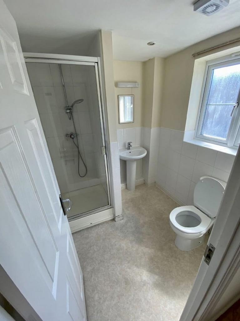 Modern bathroom suite featuring a spacious show...