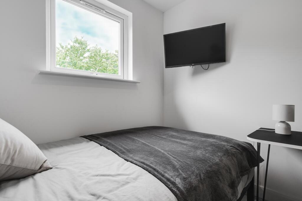Cozy double bedroom featuring a comfortable bed...