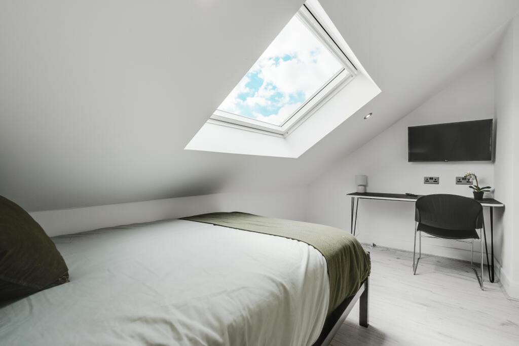 A stylish double bedroom featuring a comfortabl...