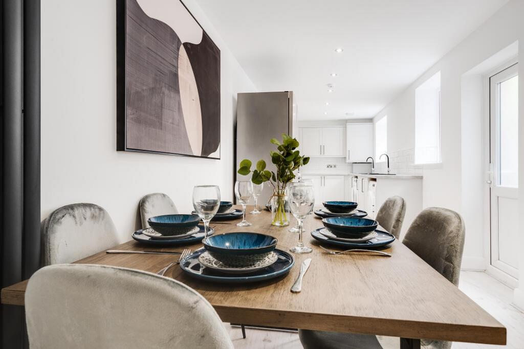 A modern kitchen featuring a spacious dining ar...