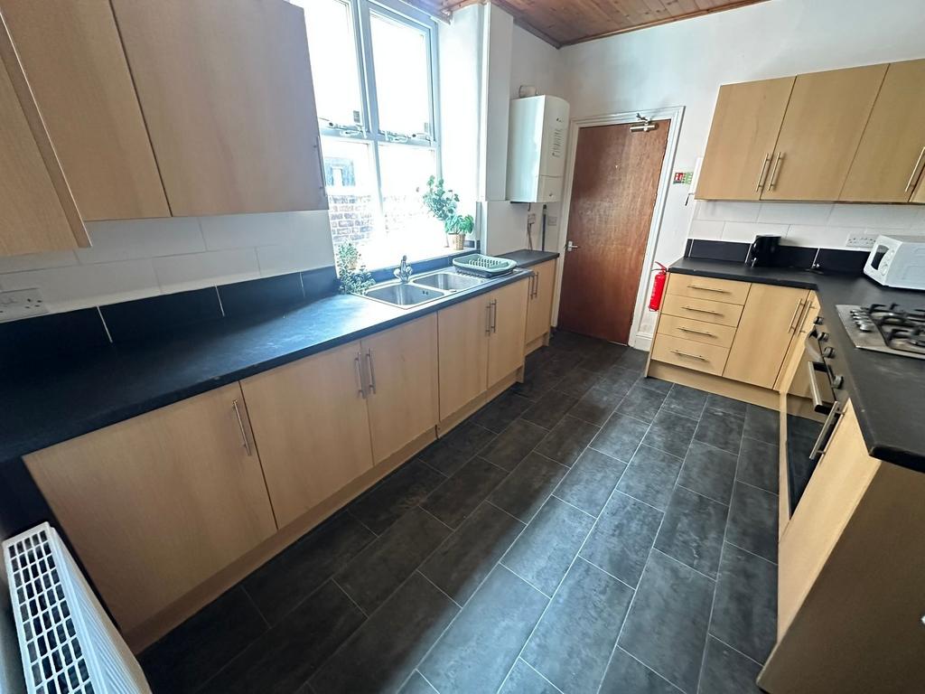 Bright and inviting kitchen with ample natural ...