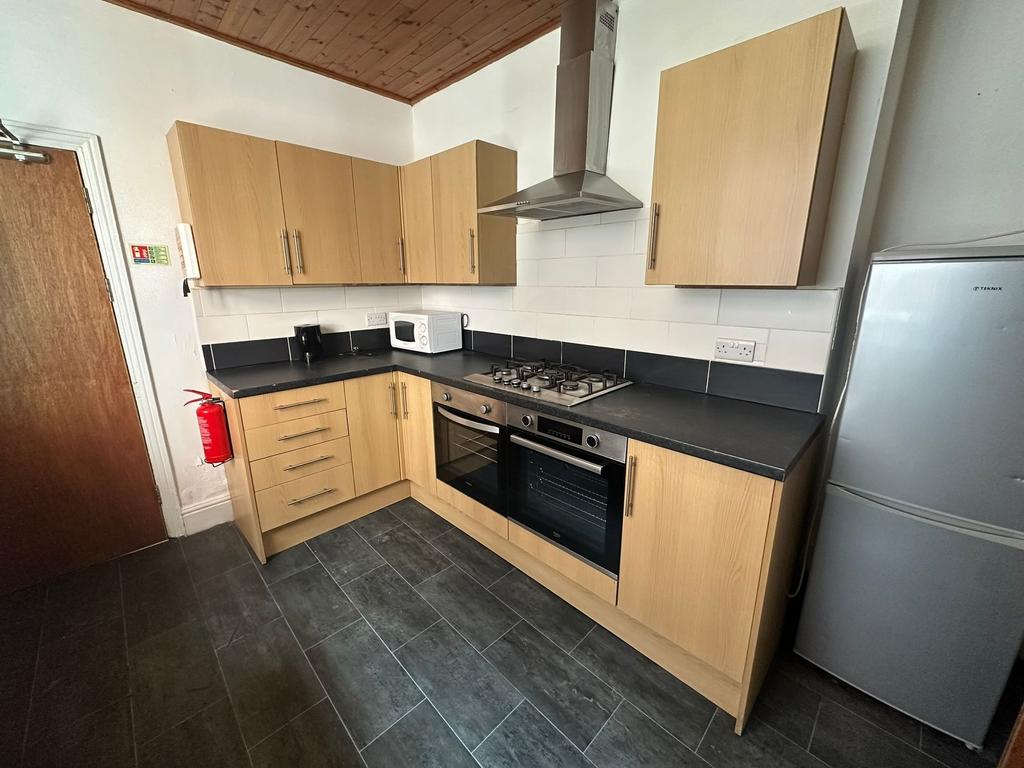 Modern and clean kitchen featuring wooden cabin...