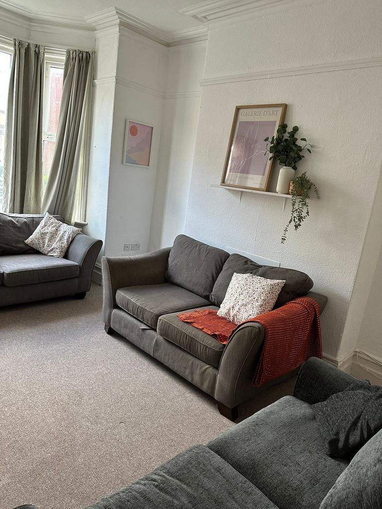 Bright and welcoming living room featuring larg...