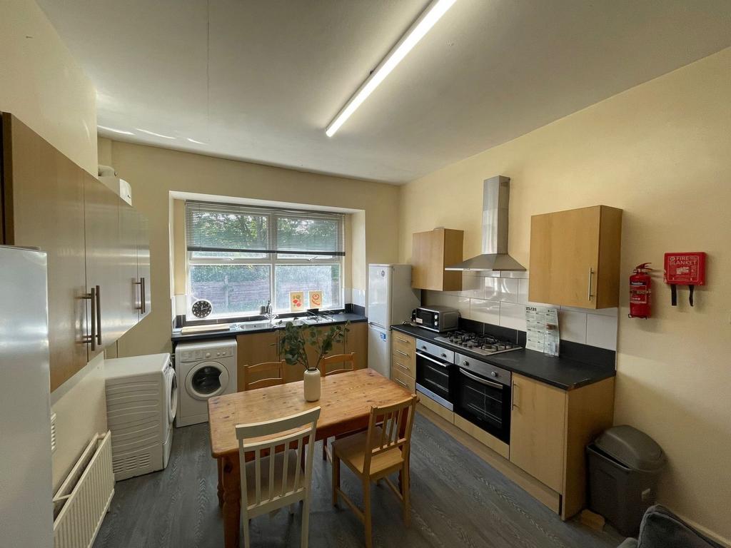 Bright and functional kitchen featuring a large...