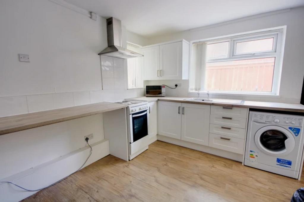 A modern and well-equipped kitchenette featurin...
