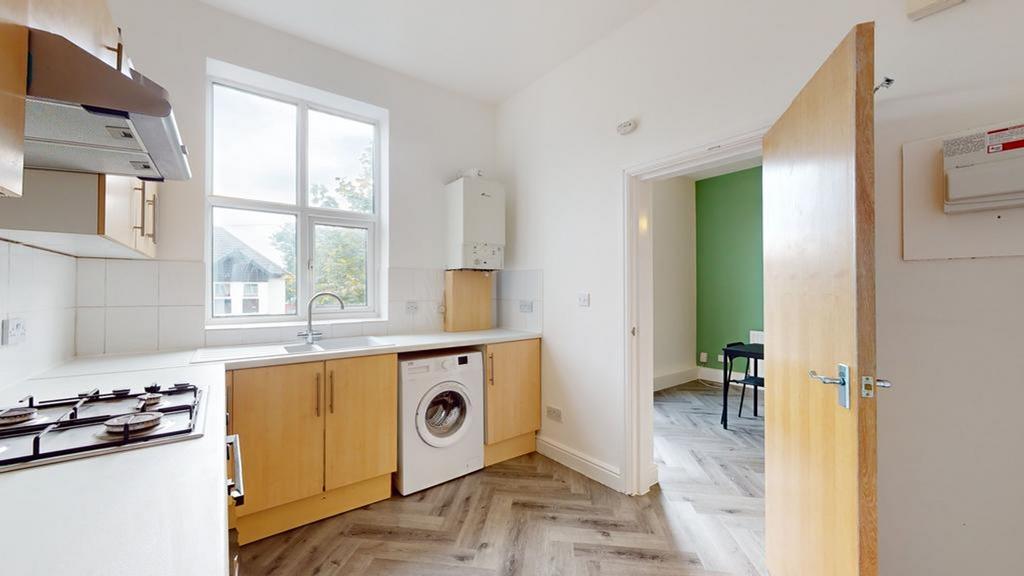 A bright and modern kitchenette featuring ample...