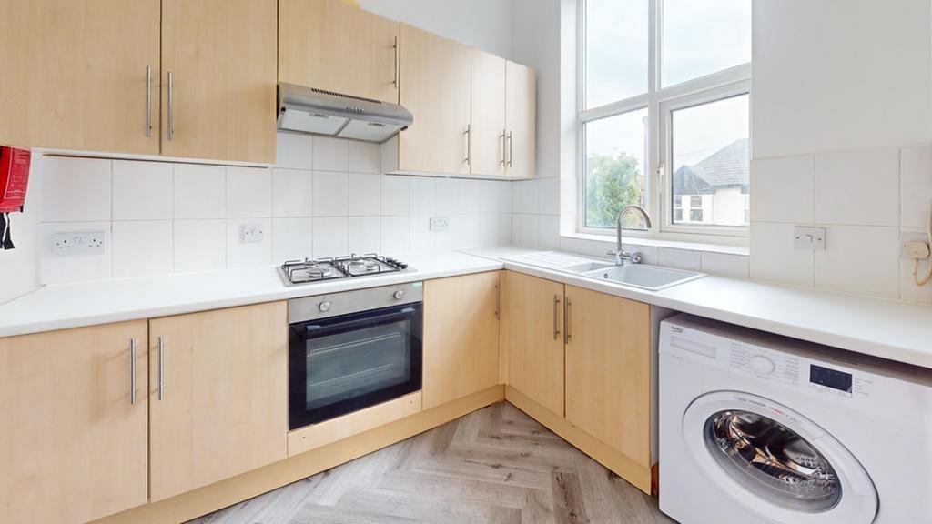 A bright and tidy kitchenette featuring modern ...