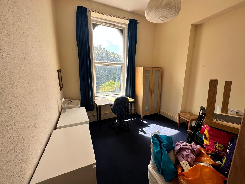 A bright and spacious double bedroom with ample...