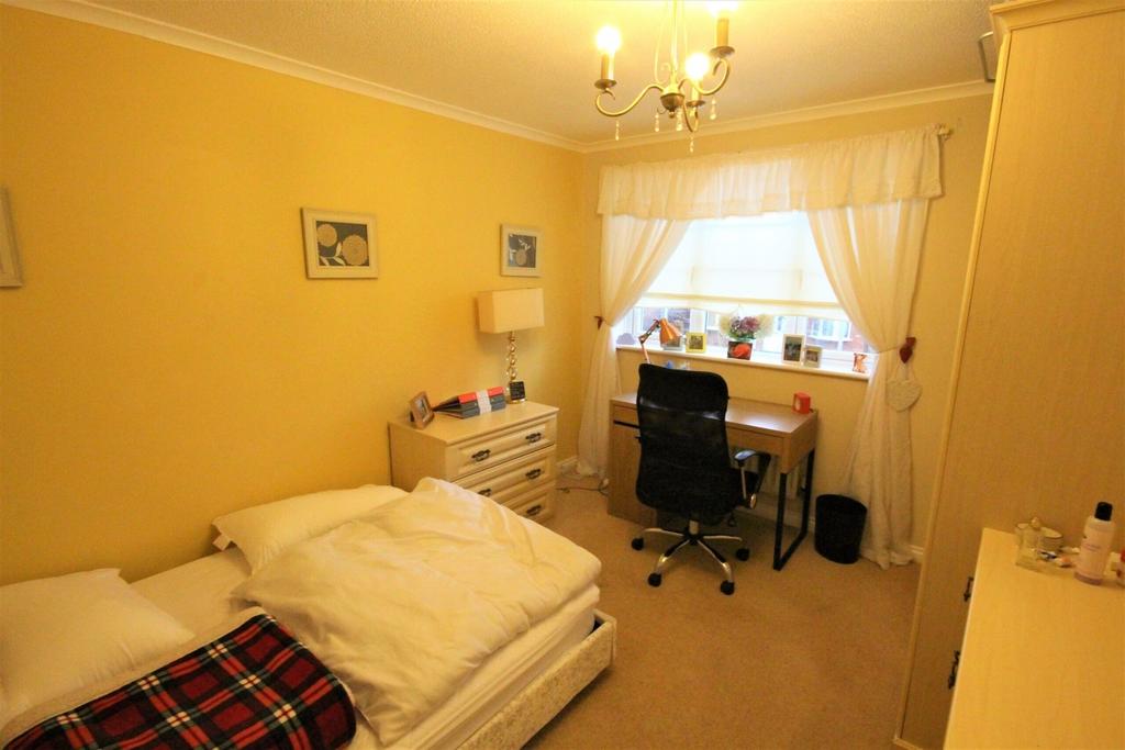 A cozy and inviting double bedroom featuring a ...