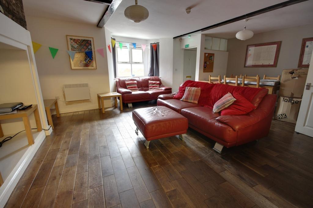 A spacious and inviting modern living room, per...
