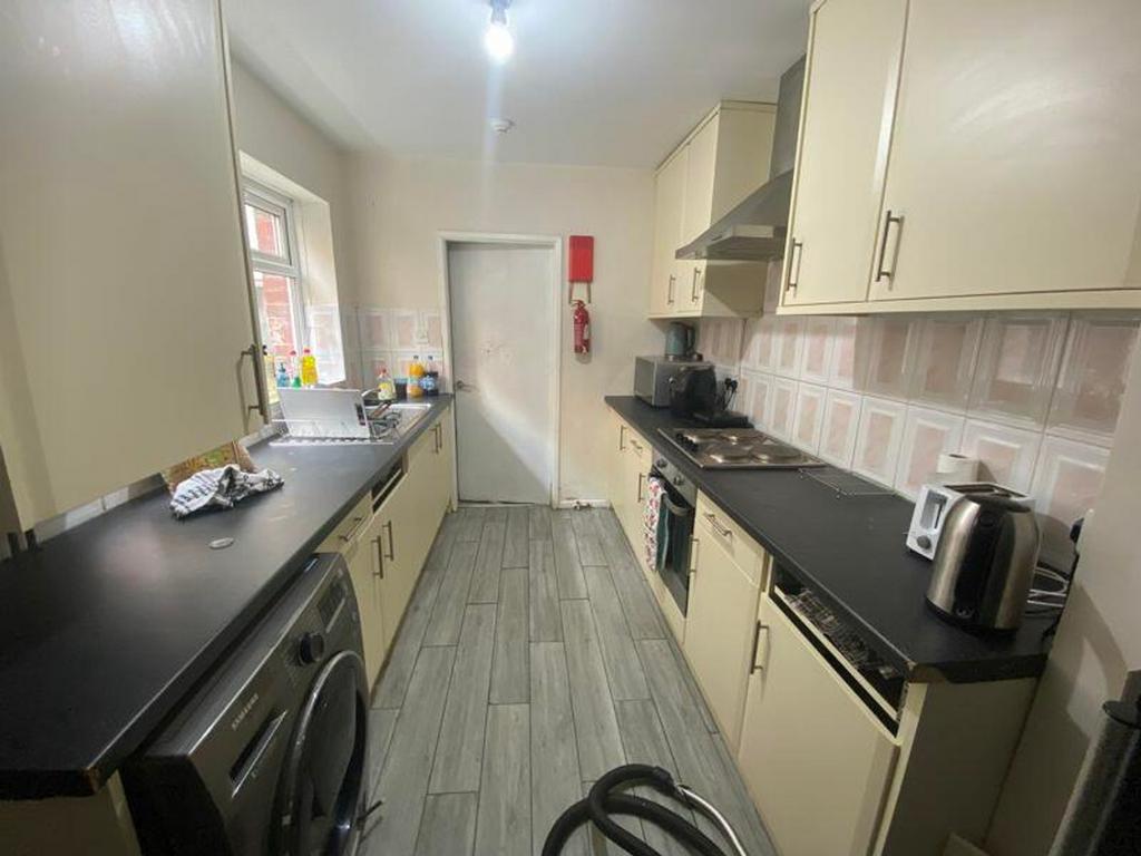 A modern and functional kitchen featuring ample...