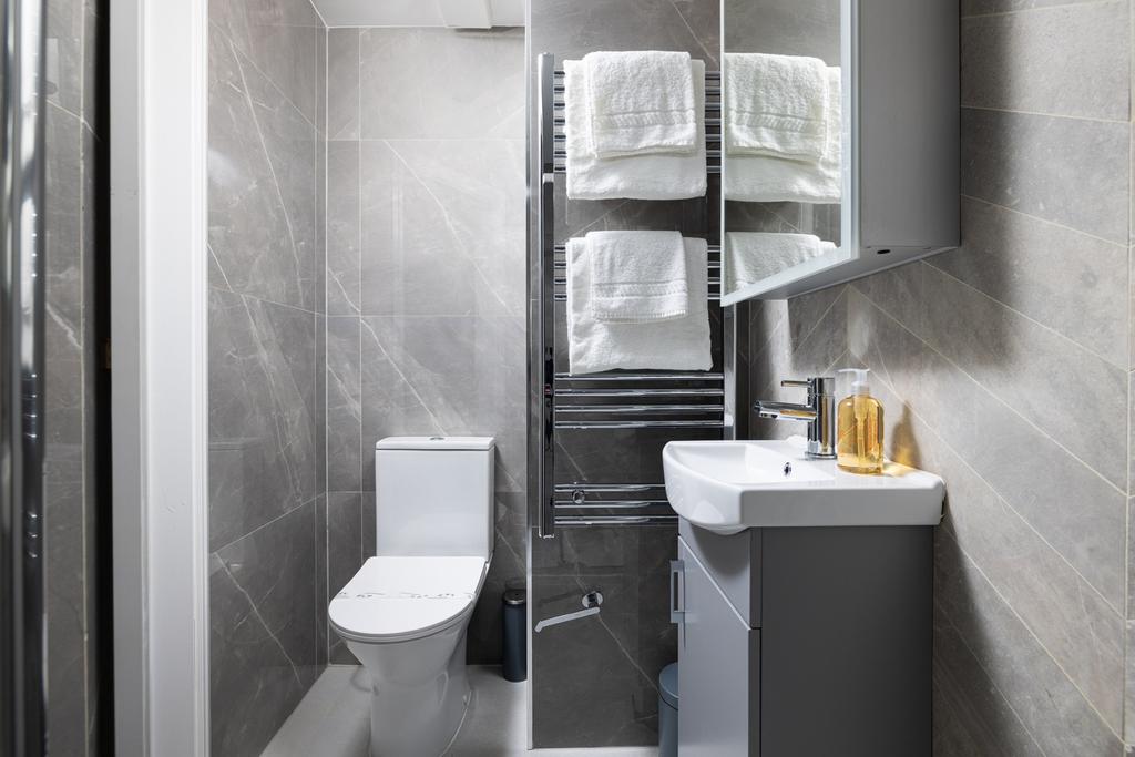 Modern and stylish bathroom featuring sleek fix...