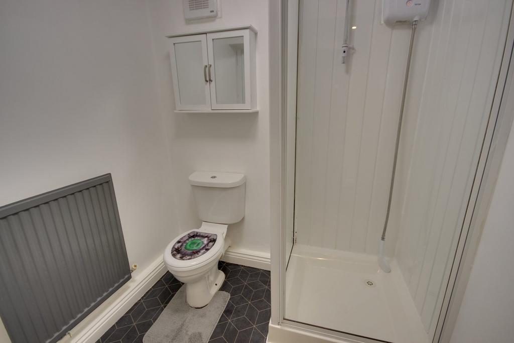 A clean and modern bathroom featuring a spaciou...