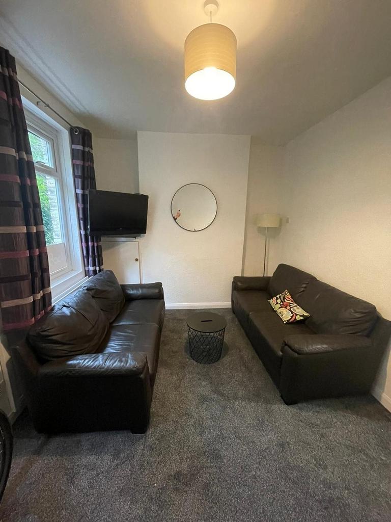 A cozy living room featuring comfortable seatin...