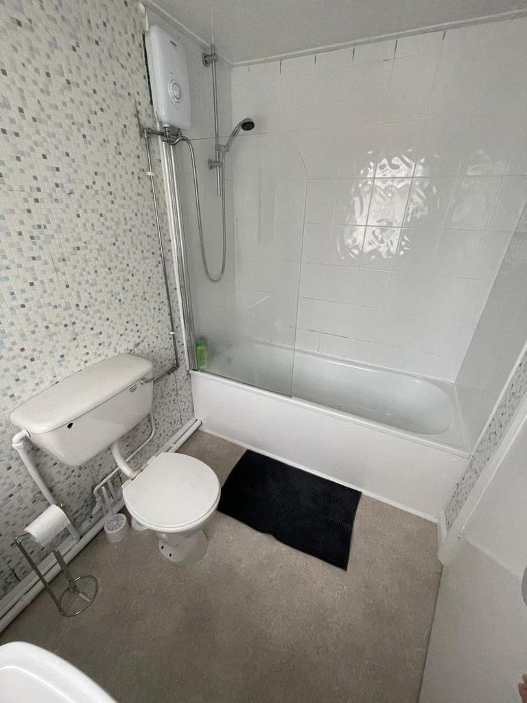 A modern and clean bathroom featuring a shower ...