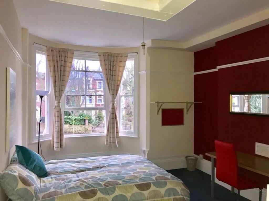 Bright and spacious double bedroom featuring la...