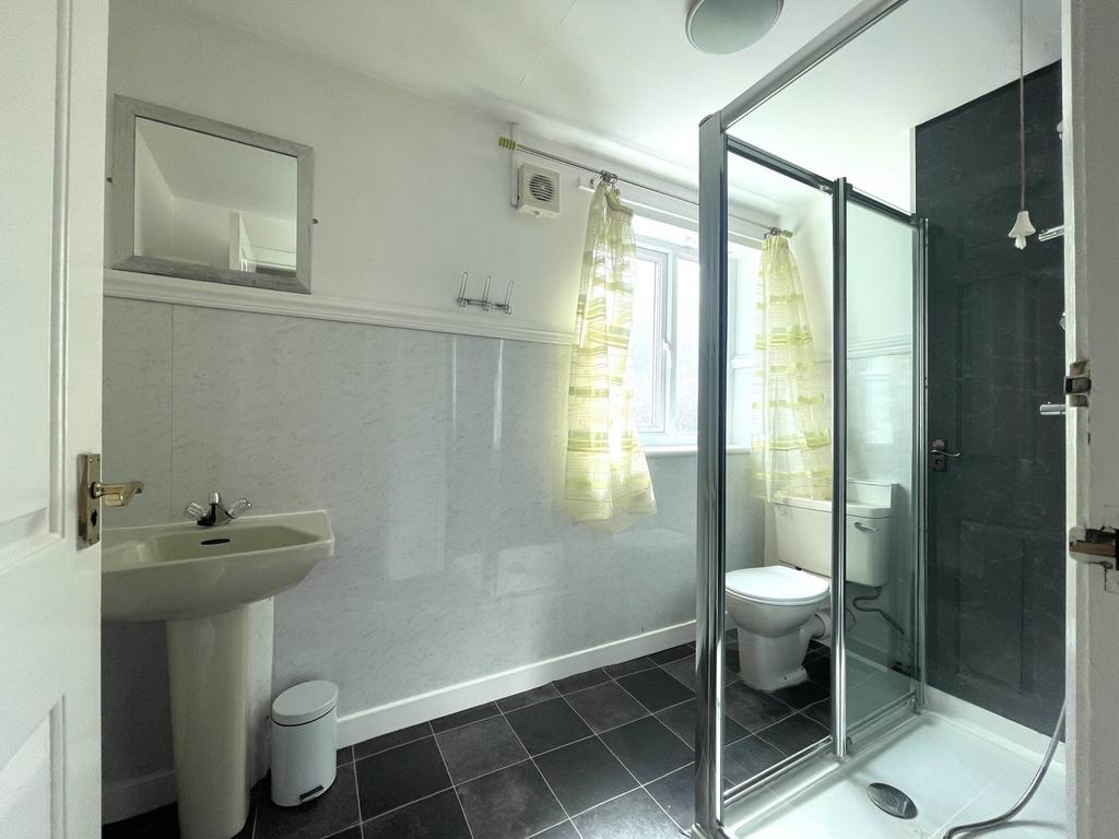 A bright and modern bathroom featuring a spacio...