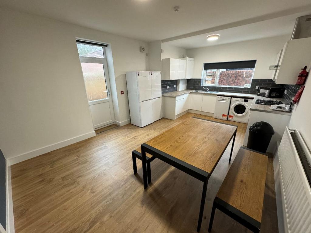 A modern kitchen featuring ample space for meal...