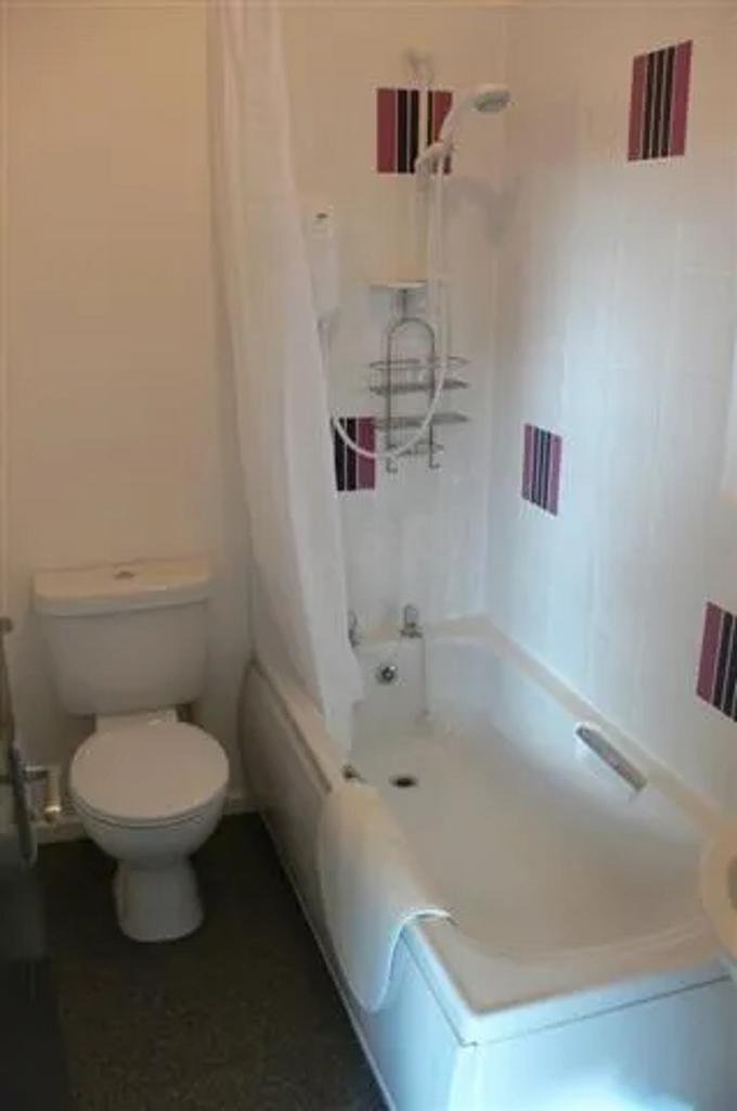 A clean and functional bathroom featuring a bat...