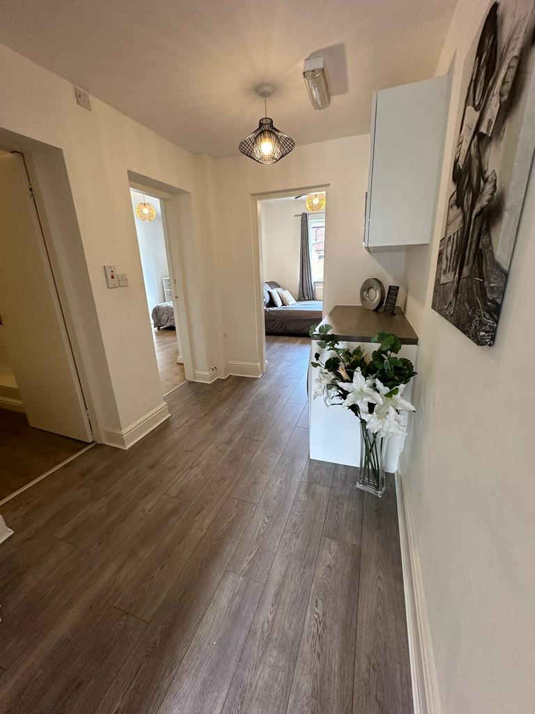 A stylish and welcoming hallway featuring moder...
