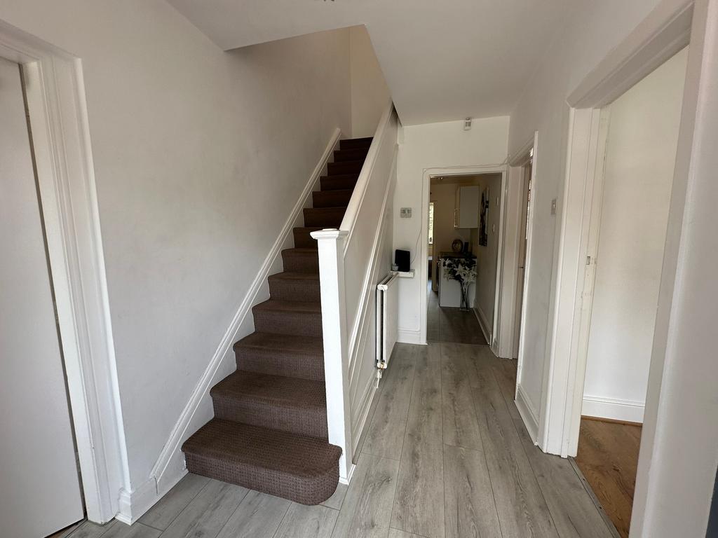 Welcoming hallway featuring modern flooring and...