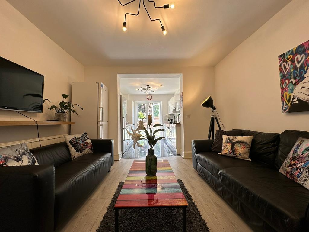 A stylish and inviting living room featuring tw...