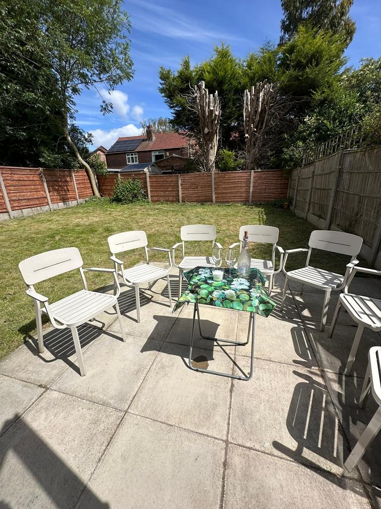 A spacious garden area featuring a well-maintai...