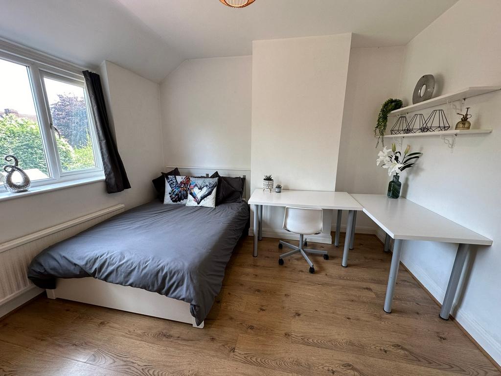 Bright and inviting double bedroom featuring a ...