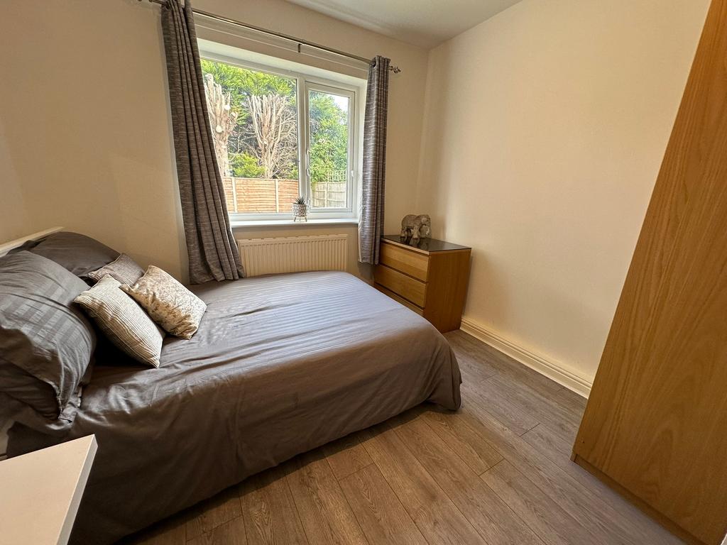 A cozy double bedroom featuring stylish decor, ...