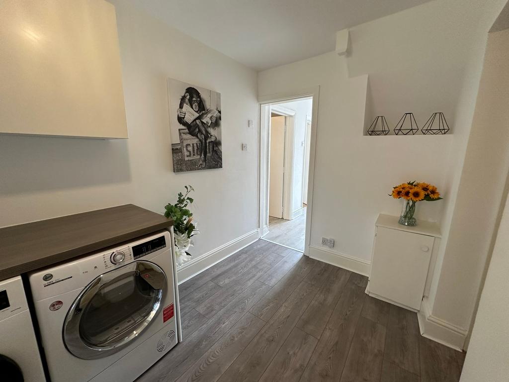 Bright and modern kitchen area featuring stylis...