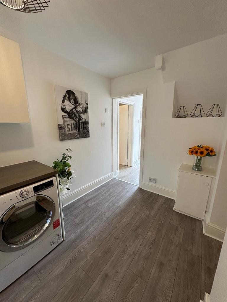 Bright and inviting kitchen area featuring mode...
