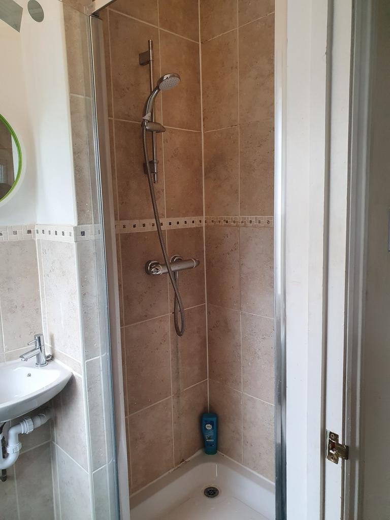 A well-maintained bathroom featuring a modern s...