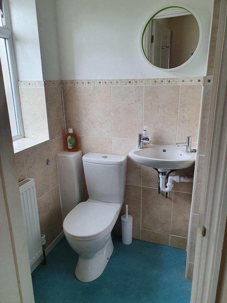 A modern bathroom featuring stylish tiles and a...