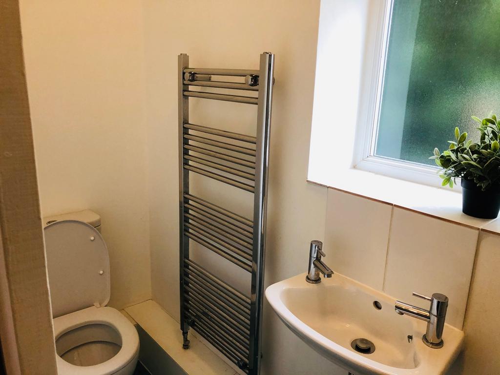A clean and bright bathroom featuring modern fi...