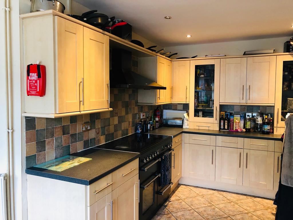 This modern kitchen features ample storage with...
