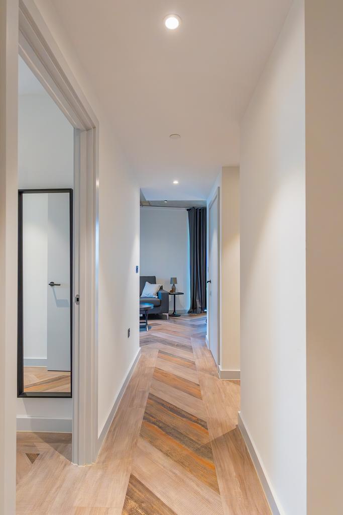 A well-maintained and bright hallway leading to...