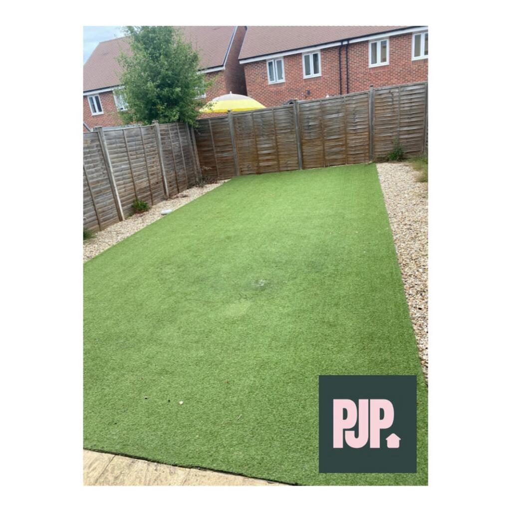 A beautifully maintained garden featuring a lus...