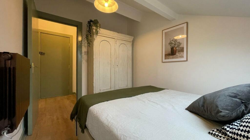A stylish and inviting double bedroom featuring...