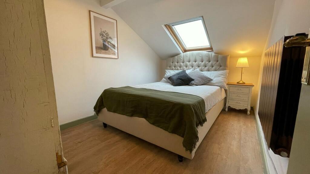 A bright and inviting double bedroom featuring ...