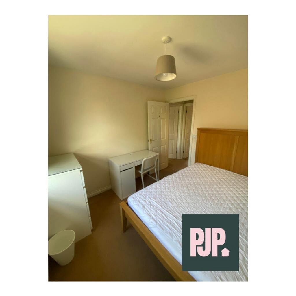 Bright and inviting double bedroom featuring a ...