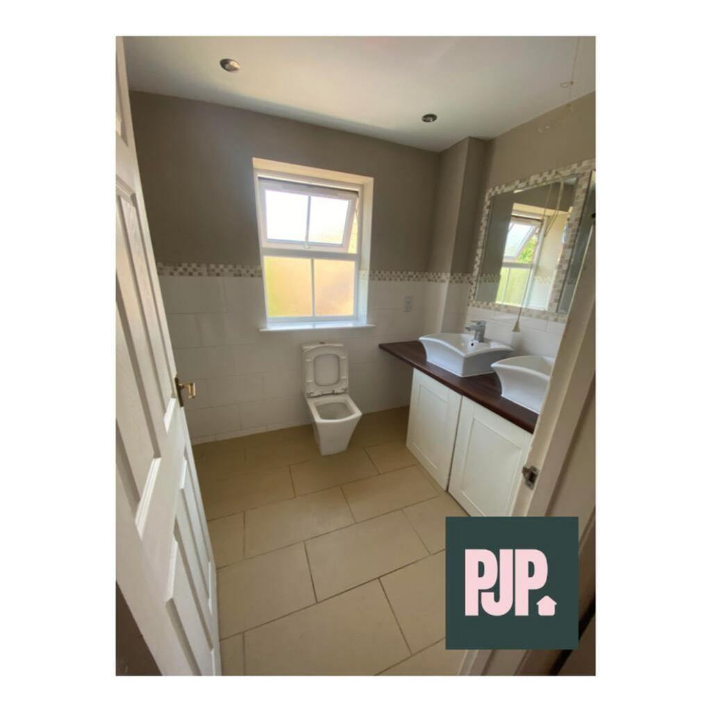 A clean and well-maintained bathroom featuring ...