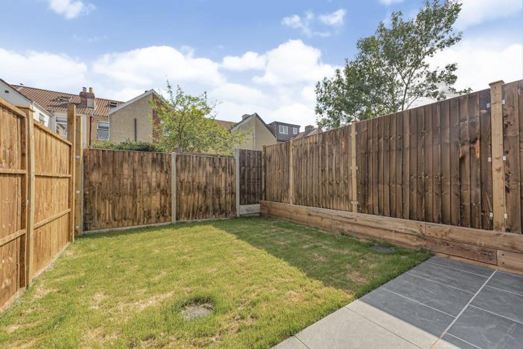 A charming garden space featuring well-maintain...