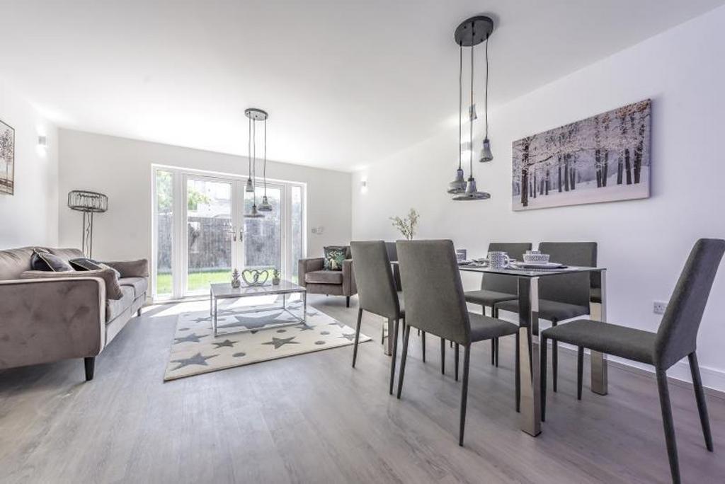 Bright and spacious living room featuring moder...