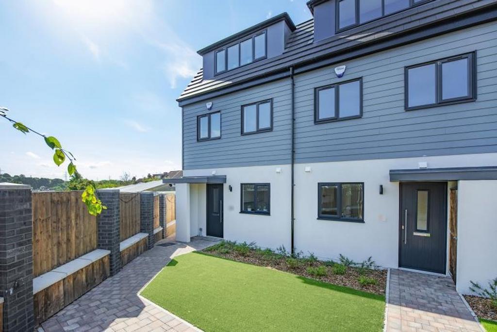 This modern exterior showcases a beautifully de...