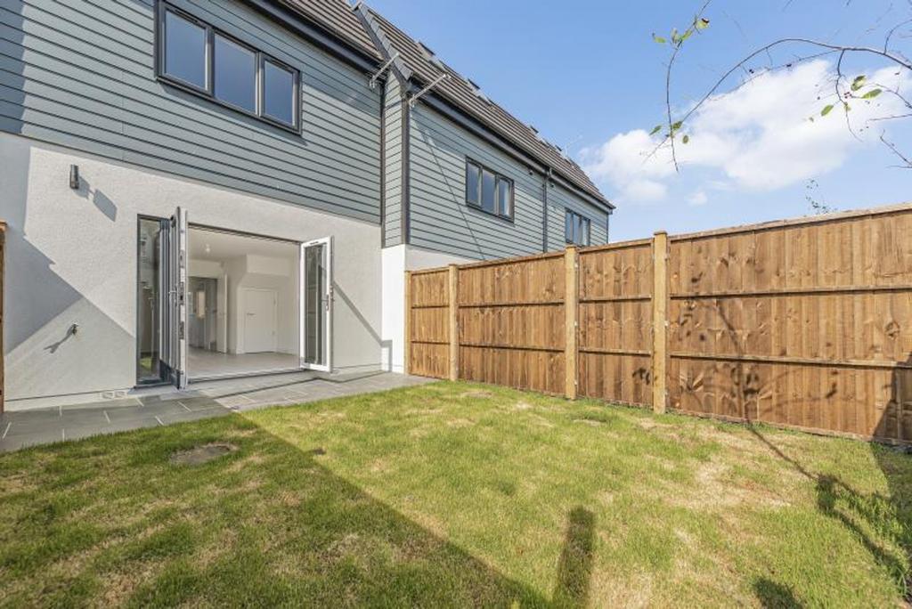 A beautifully maintained garden with lush green...