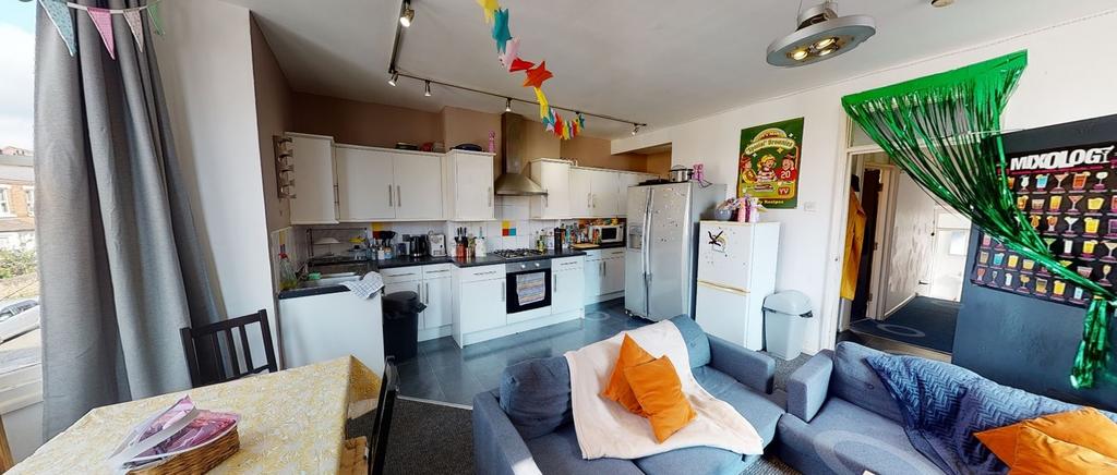 A spacious and well-lit kitchen featuring moder...