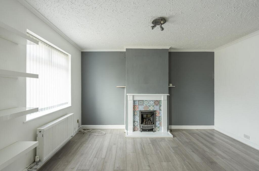 A spacious living room featuring a charming fir...
