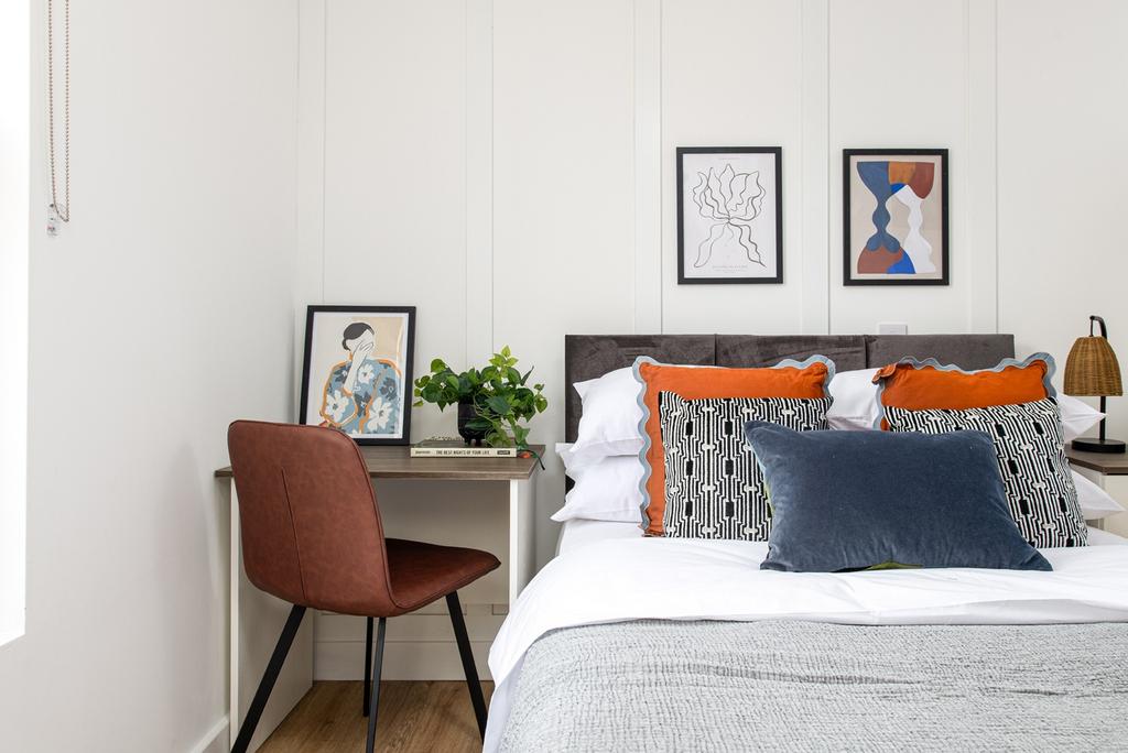 A stylish double bedroom featuring a comfortabl...