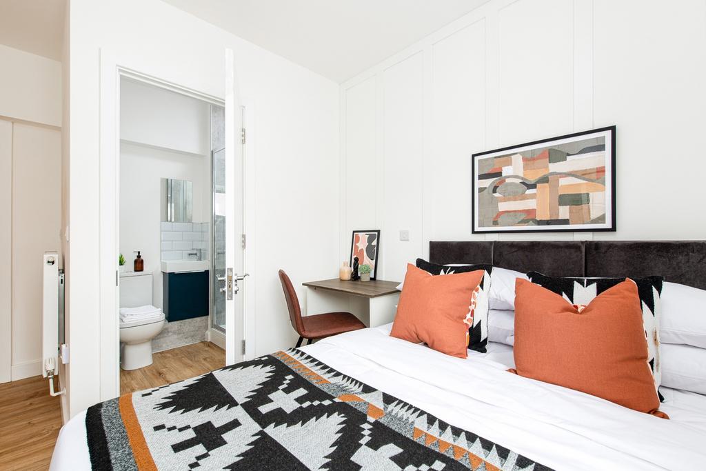 A stylish double bedroom featuring a comfortabl...