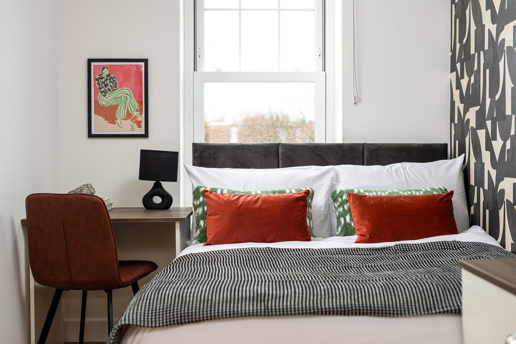 A beautifully designed double bedroom featuring...
